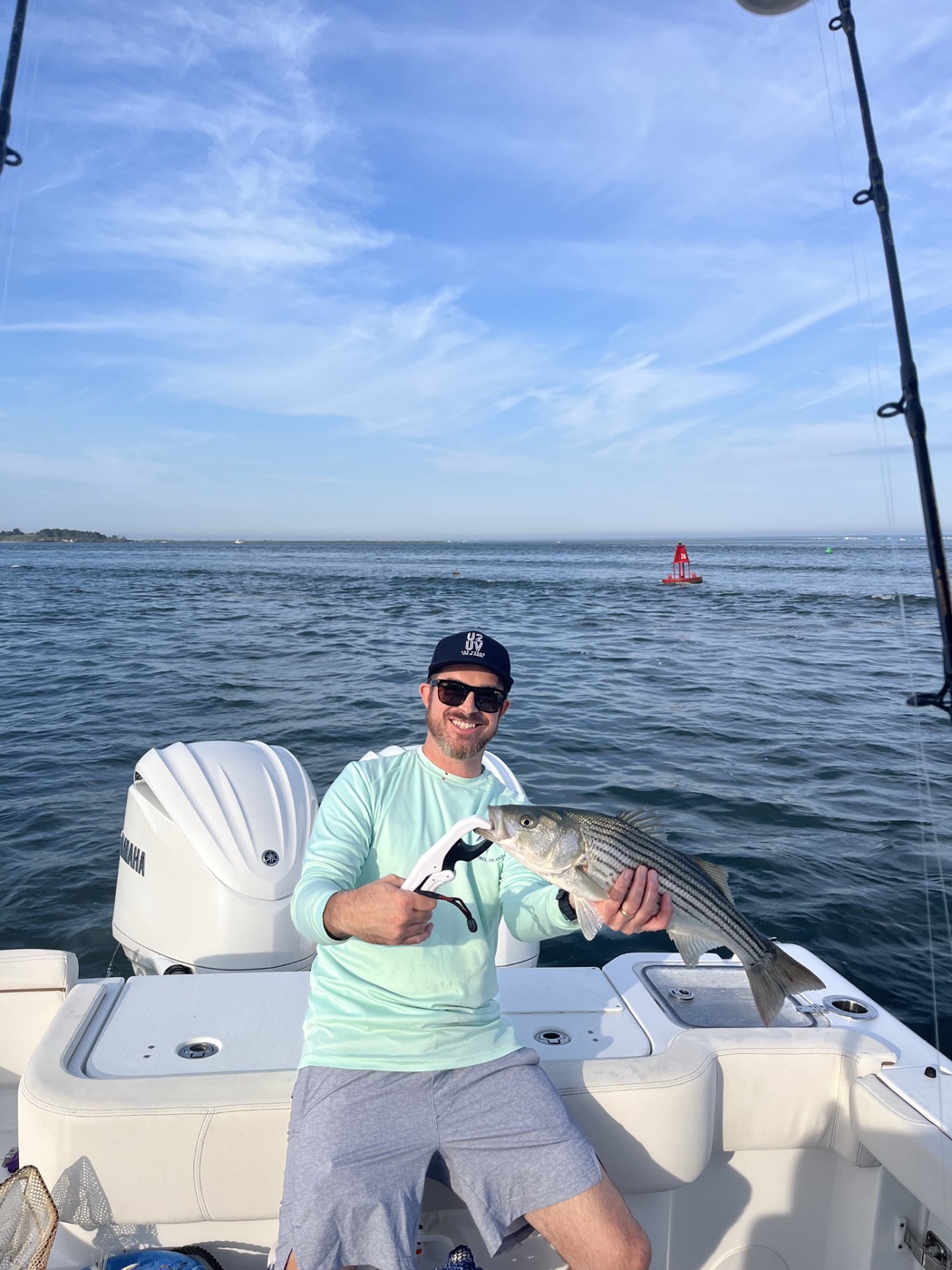 Angler with a striped bass