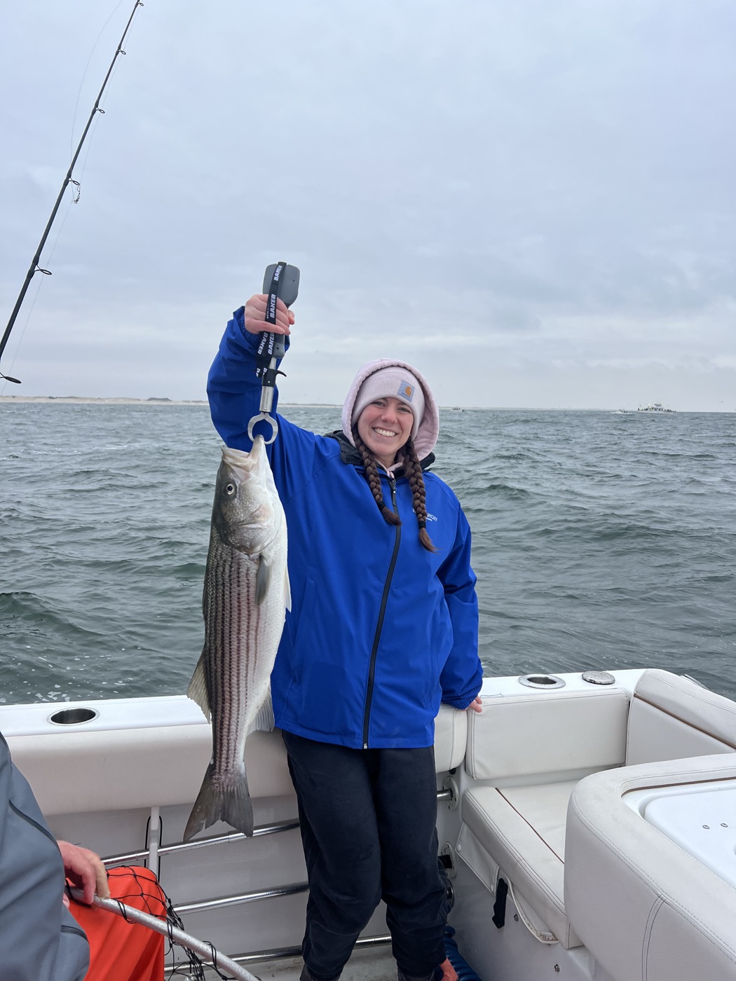 Angler with a striped bass