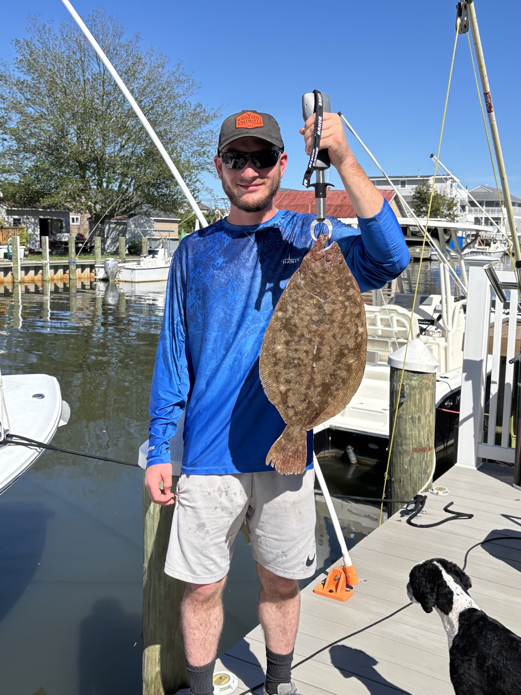 Angler holding a flounder