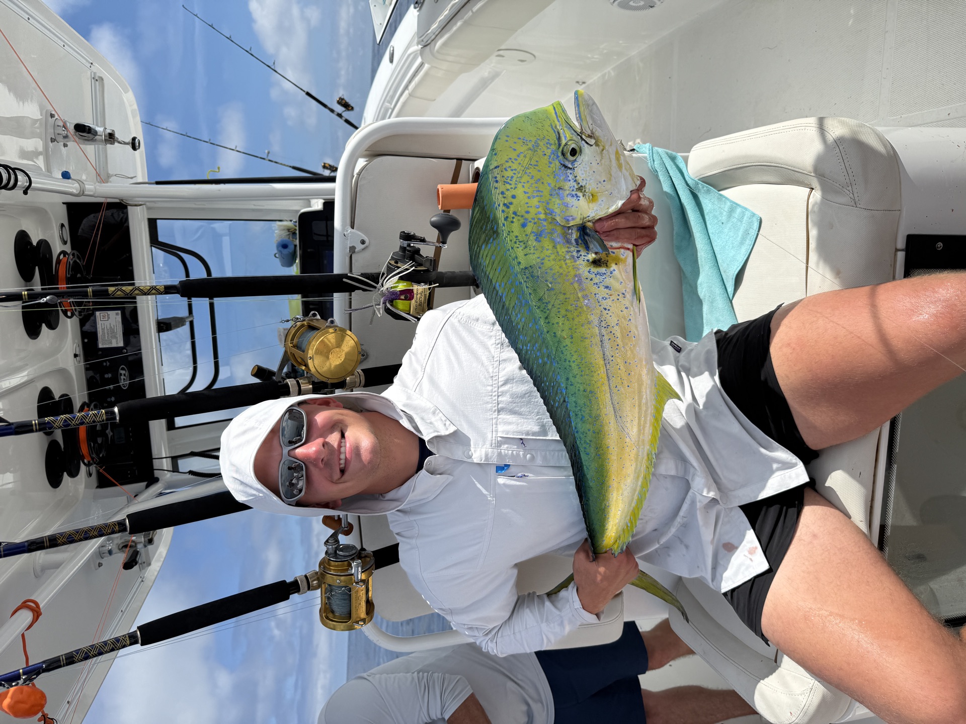 Angler holding a big mahi mahi offshore near Stuart, Florida